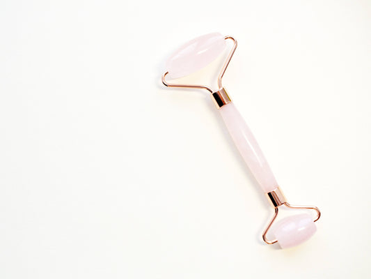 Rose Quartz Roller for facial massage, designed to promote relaxation and enhance skin's natural glow